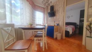 a small room with a desk and a bedroom at Apartment MrC , FREE PARKING in Bežanija