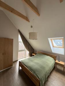 a bedroom with a bed and a large window at Aura Kaszub Lake&Forest in Łączyno +33 photos