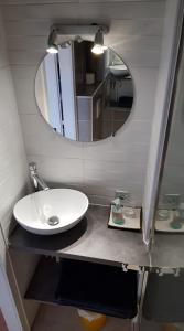 a bathroom with a sink and a mirror at New ! VUE PETITE VENISE-PLACE TO BE - PARKING in Colmar