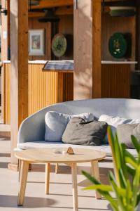 a couch and a coffee table in a room at Pizzomunno Vieste Palace Hotel in Vieste