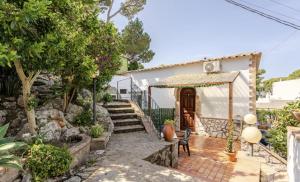 a house with a staircase leading to the front door at Authentic Oasis - Villa La Solara in Anacapri