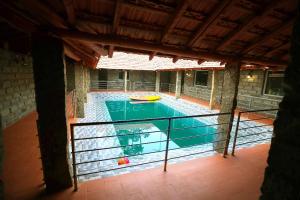 an empty swimming pool with a yellow boat in it at Annmees Freedom Land in Bangalore