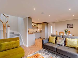 a living room with a couch and a kitchen at 1 Bed in Ilkley oc-87569 in Ilkley