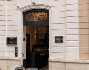 a doorway to a restaurant with a counter in a building at Sparano Palace - Luxury Maison in Bari