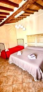 two beds sitting next to each other in a room at Casa del Sole in Gambassi Terme +12 photos