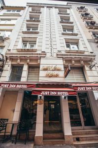 a building with ajust him hotel sign in front of it at Just Inn Hotel in Istanbul