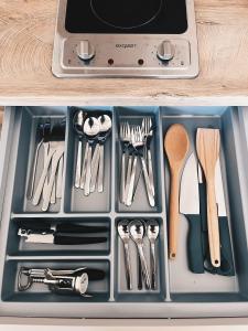 a tray filled with utensils in a drawer at Alter Bahnhof Sichtigvor in Warstein