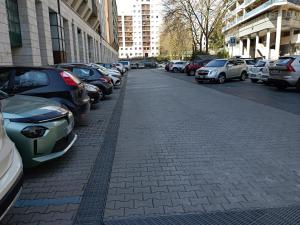 a row of parked cars on a city street at Il nido Perugia in Perugia