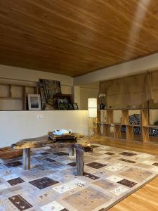 a room with a table and a rug on the floor at Salem House in Da Lat