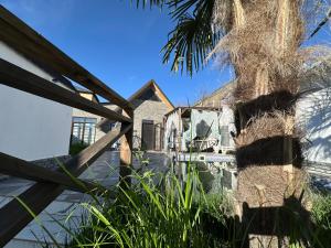 a palm tree in front of a house at Firepalace Gabala in Gabala