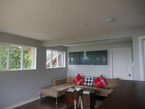 a living room with a couch and a table at Howe Sound View in Bowen Island