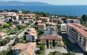 an aerial view of a small town next to the ocean at Casa vacanza Iris in Toscolano Maderno
