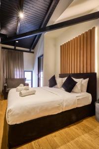 a bedroom with a large bed in a room at Mamy Blue Slow Living in Athens