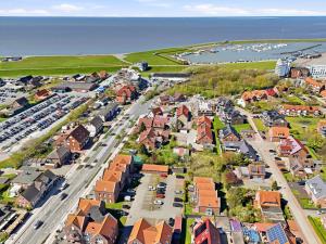 an aerial view of a small town with a harbor at Anika in Norddeich