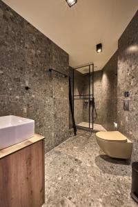 a bathroom with a sink and a toilet and a shower at Mamy Blue Slow Living in Athens +74 photos
