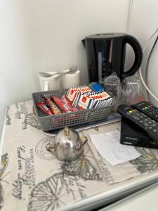 a table with a tray of candy and a coffee maker at Casa Borgo in Bale