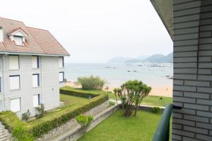 a view of the beach from a house at Apartamentos Salceda in Noja