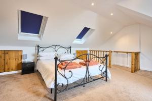 a bedroom with a bed in a attic at Host & Stay - 2a Hamilton Road in Felixstowe +7 photos