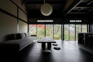 a living room with a couch and a table at MUSUBI Hakone in Sengokuhara