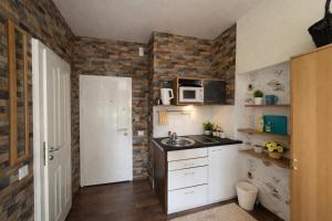 a small kitchen with a sink and a microwave at Gelsenkirchen Am Flöz in Gelsenkirchen
