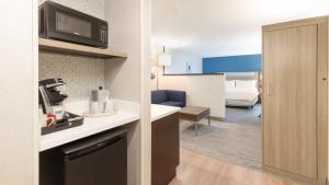 a room with a kitchen and a living room at Holiday Inn Express Bellingham by IHG in Bellingham