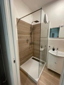 a shower with a glass door in a bathroom at l'impronta in Gorizia