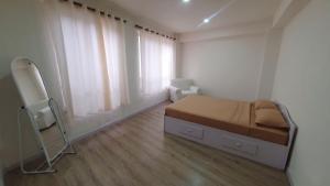 a bedroom with a bed and a mirror in it at BasantapurRooms in Kathmandu