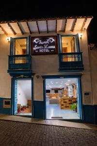 a store with a sign on the side of a building at Hotel Santa Laura in Jericó