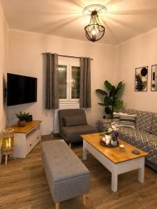 a living room with a couch and a table at Evanthia's House in Arianá