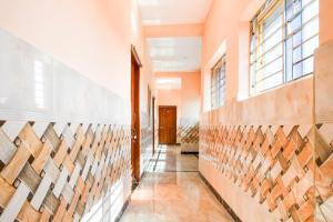 a hallway with wood panels on the wall at Hotel O Bhubaneshwar Near ITER College in Bhubaneshwar