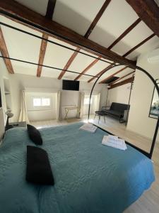 a bedroom with a large bed in a room at l'impronta in Gorizia