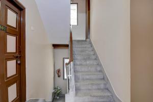 a stairway in a building with a stair case at Super Hotel O Howrah Railway Station in Kolkata