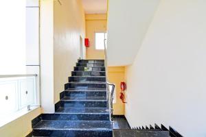 a staircase in a building with blue steps at Super OYO Townhouse Dwarakanagar Near Gurudwara in Visakhapatnam