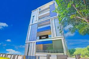 a building with a sign on the side of it at Super OYO Townhouse Dwarakanagar Near Gurudwara in Visakhapatnam