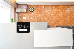 a meeting room with a sign on a wall at Super Collection O Godavari Kompally in Hyderabad