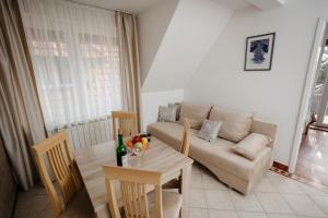 a living room with a couch and a table at Markov Konak in Divčibare