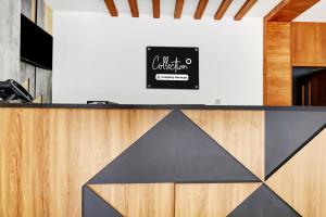 a counter in a restaurant with a sign on the wall at Collection O Munnar in Munnar