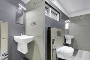 a bathroom with a toilet and a sink at Collection O Munnar in Munnar