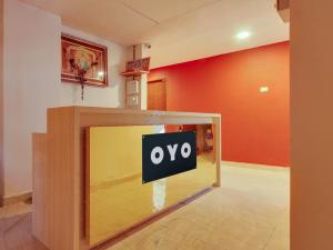 a tv with a percent sign on it in a room at Super Collection O Bommarilu Warangal in Warangal