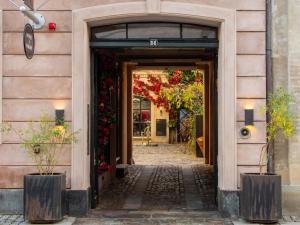 an entrance to a building with flowers on it at Four Suites Copenhagen - Boutique Townhouse Suites in Copenhagen