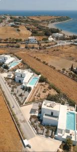 an aerial view of a resort with a pool at Seacarf Villa, 3 magnificent properties in Lachania beach, Bedrooms 12, Sleeps 27 in Lachania