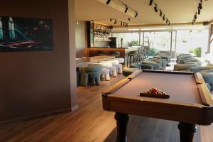 a pool table in a room with a bar at Casa d'Amares in Amares