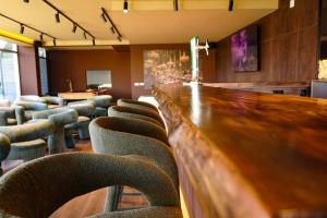 a long bar in a room with chairs and tables at Casa d'Amares in Amares +283 photos