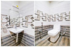 a bathroom with a toilet and a sink at OYO Hotel O Gurudwara Near RTC Complex in Visakhapatnam