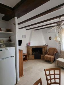 a living room with a couch and a fireplace at Apartamentos El Tosal 7E in Calpe
