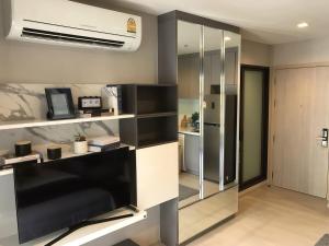 a living room with a black and white room at Thong Lor condo Next to BTS in Bangkok +1 photo