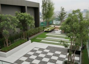 a garden on the side of a building at Thong Lor condo Next to BTS in Bangkok
