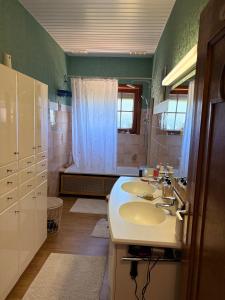 a bathroom with three sinks and a shower at Chez Tantine Nadine in Couvin