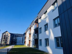 a view of an apartment building from the street at PikApart in Olsztyn