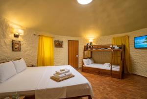 a bedroom with a bed and a bunk bed at Midnite Inn in Panglao Island +53 photos
